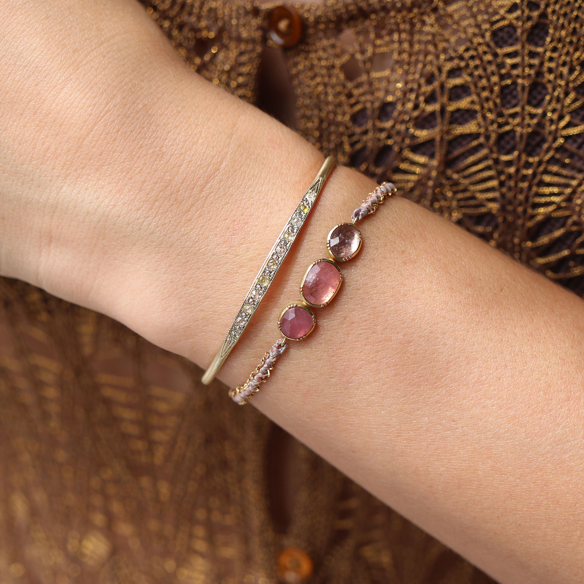 Model wearing one of a kind pink Sapphire bracelet with hand woven silk and 18k gold chain and Diammond cuff from Los Angeles jewelry designer Brooke Gregson.