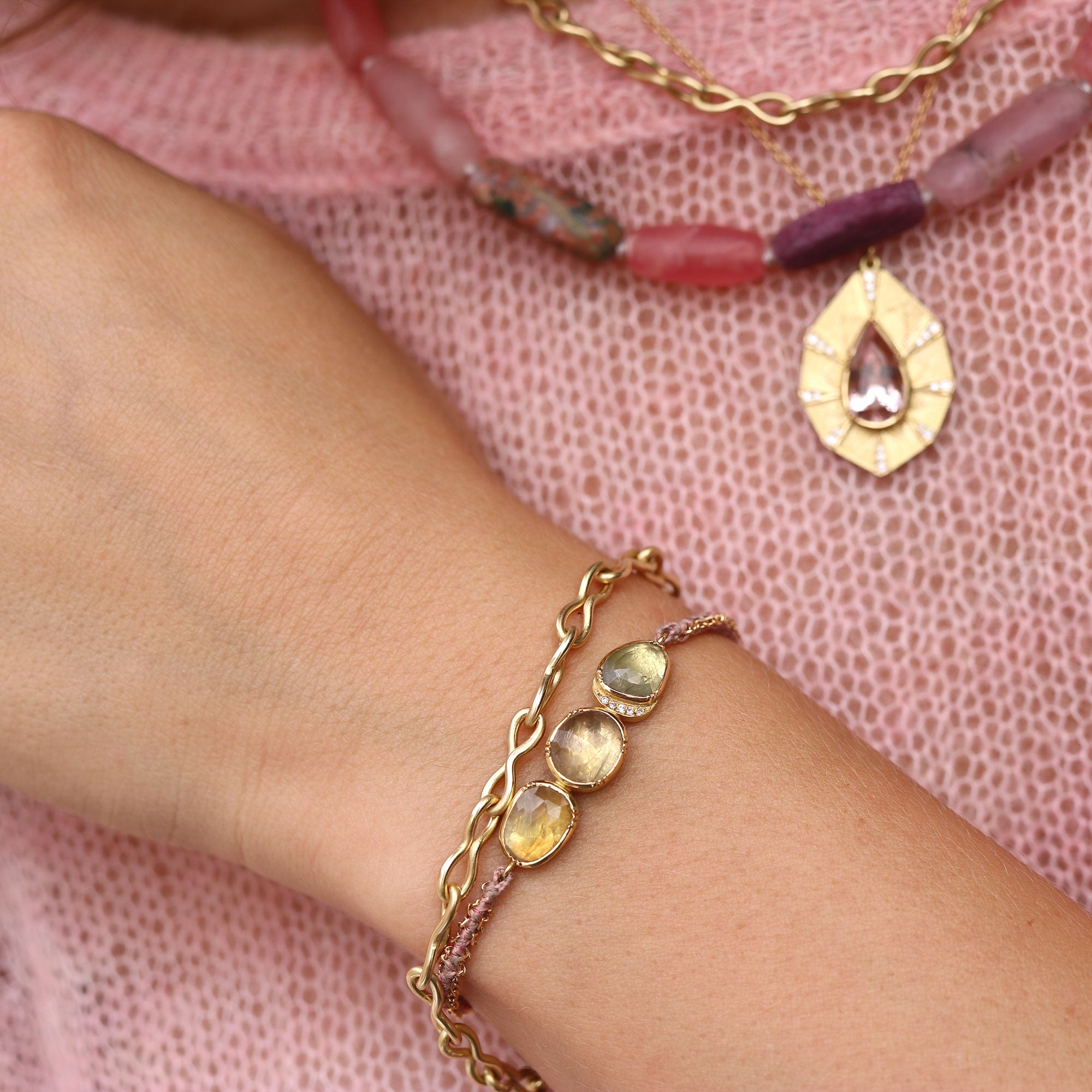 Model wearing one of a kind Sapphire and Diamond bracelet with silk and 18k gold chain from Los Angeles jewelry designer Brooke Gregson