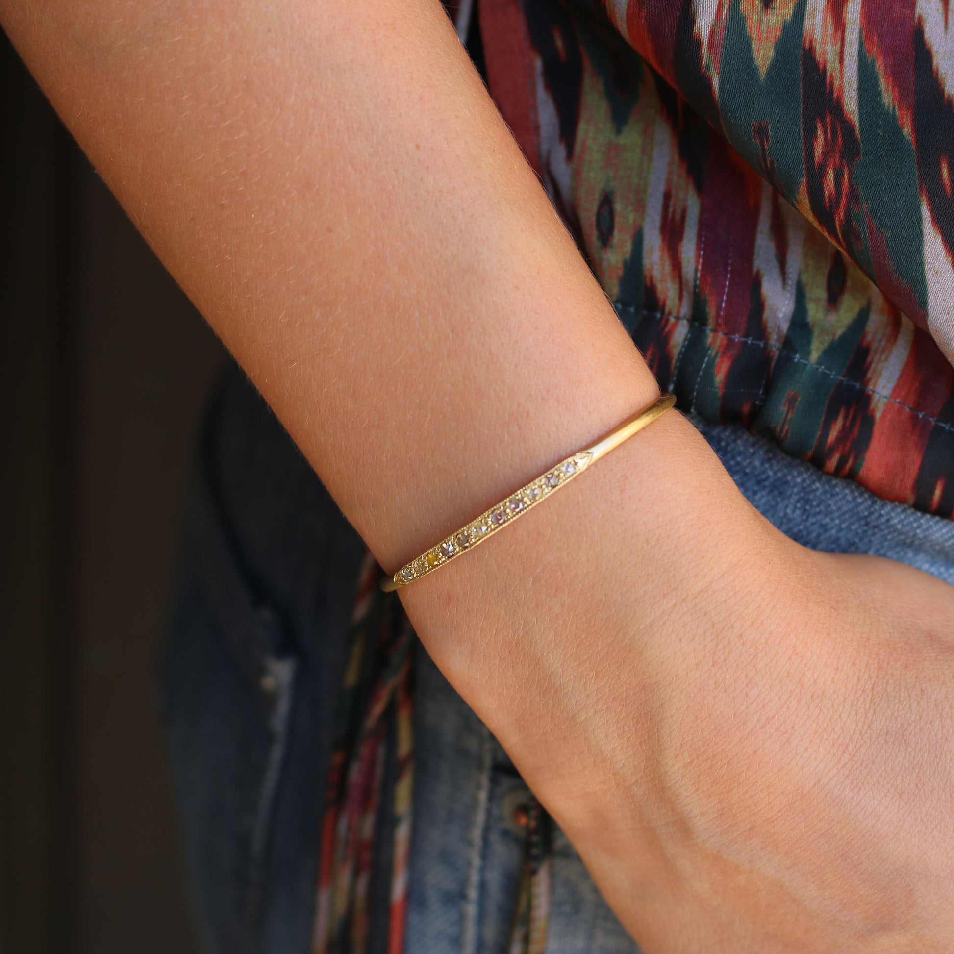 Model wearing 14k gold mixed champagne, yellow and cognac diamond cuff from Brooke Gregson handmade in Los Angeles.