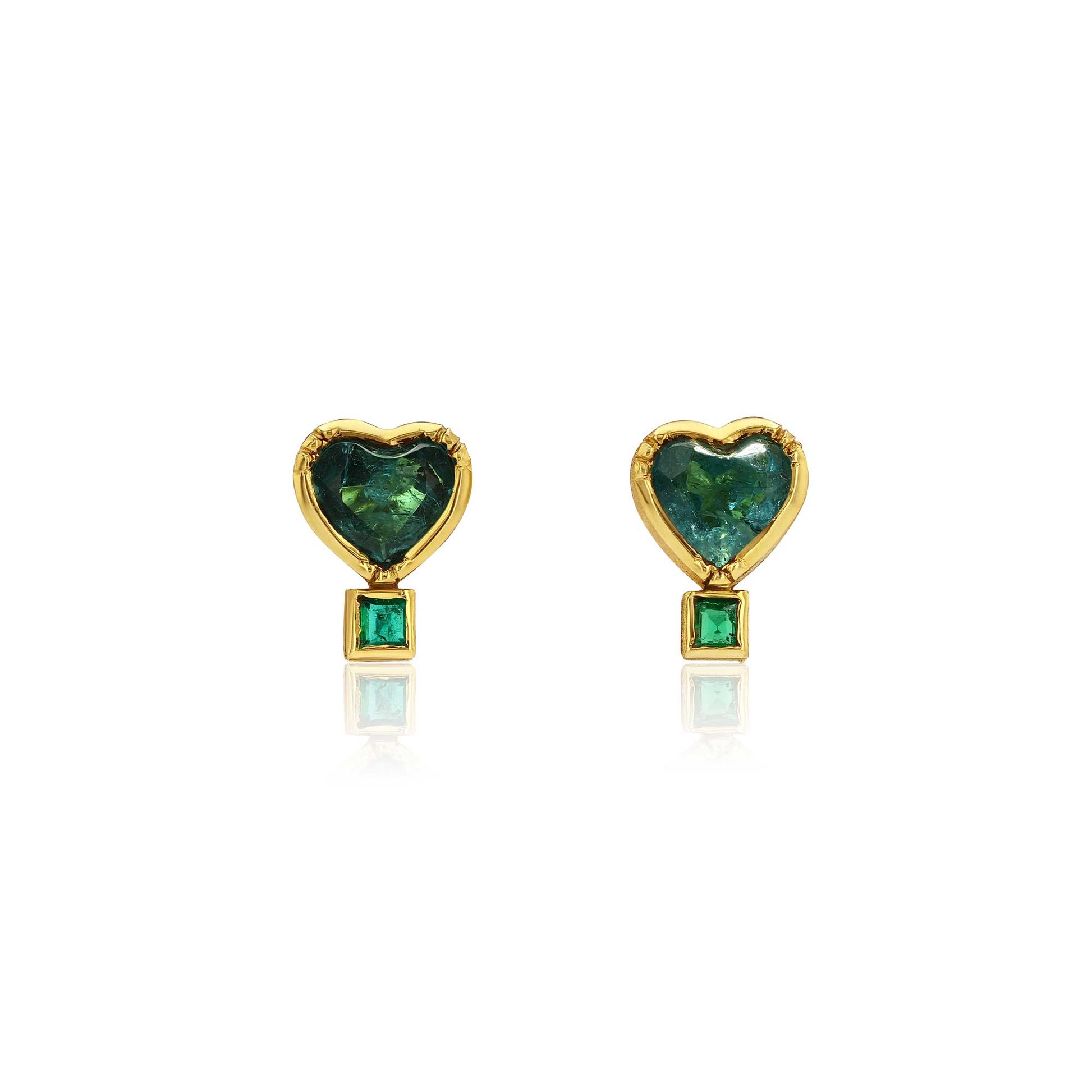 Gold heart shaped emerald and paraiba tourmaline stud earrings on a white background