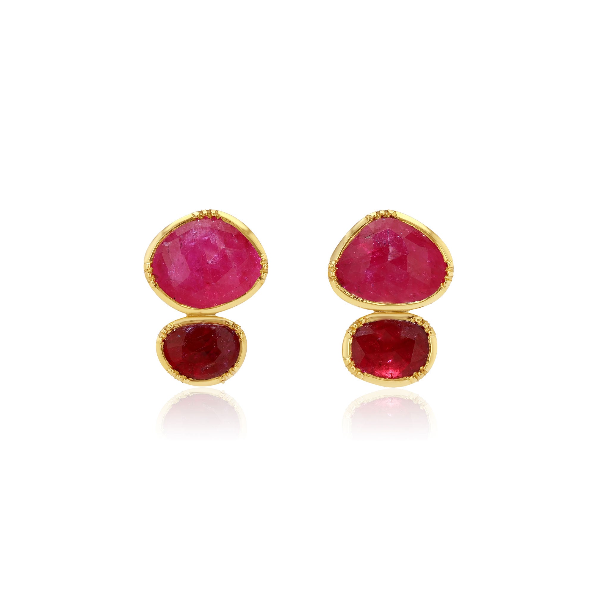 Pair of gold earrings with pink sapphire gemstones on a white background