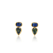 Pair of earrings with blue gemstones and gold accents on a white background