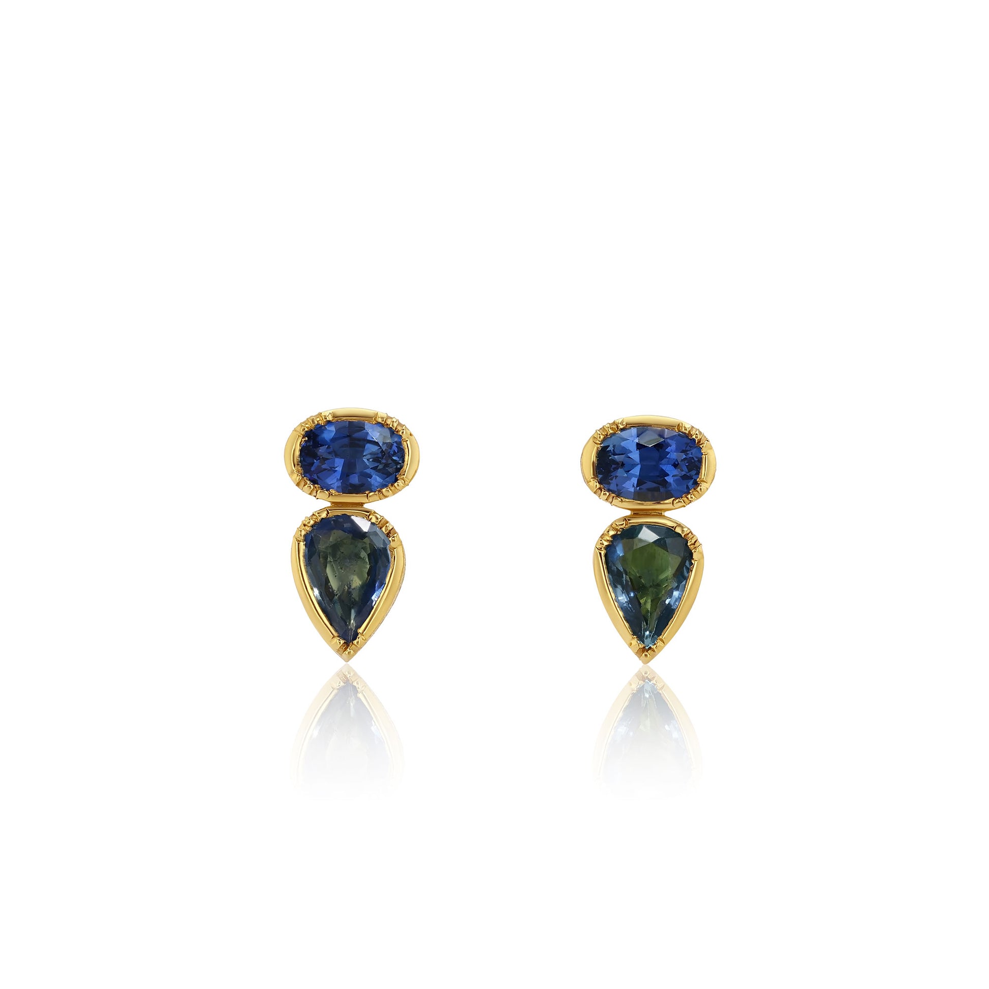 Pair of earrings with blue gemstones and gold accents on a white background