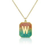 Necklace with a pendant featuring the letter 'W' on a gradient background