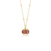18K Gold necklace with a pink tourmaline gemstone pendant on a white background