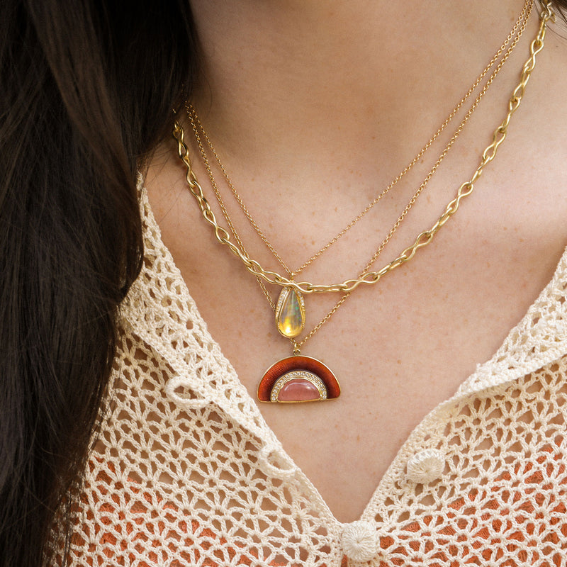 Model wearing Fire Opal, 18k gold Enamel Sunrise Rhodochrosite Necklace by Los Angeles fine jewellery designer Brooke Gregson handmade in London