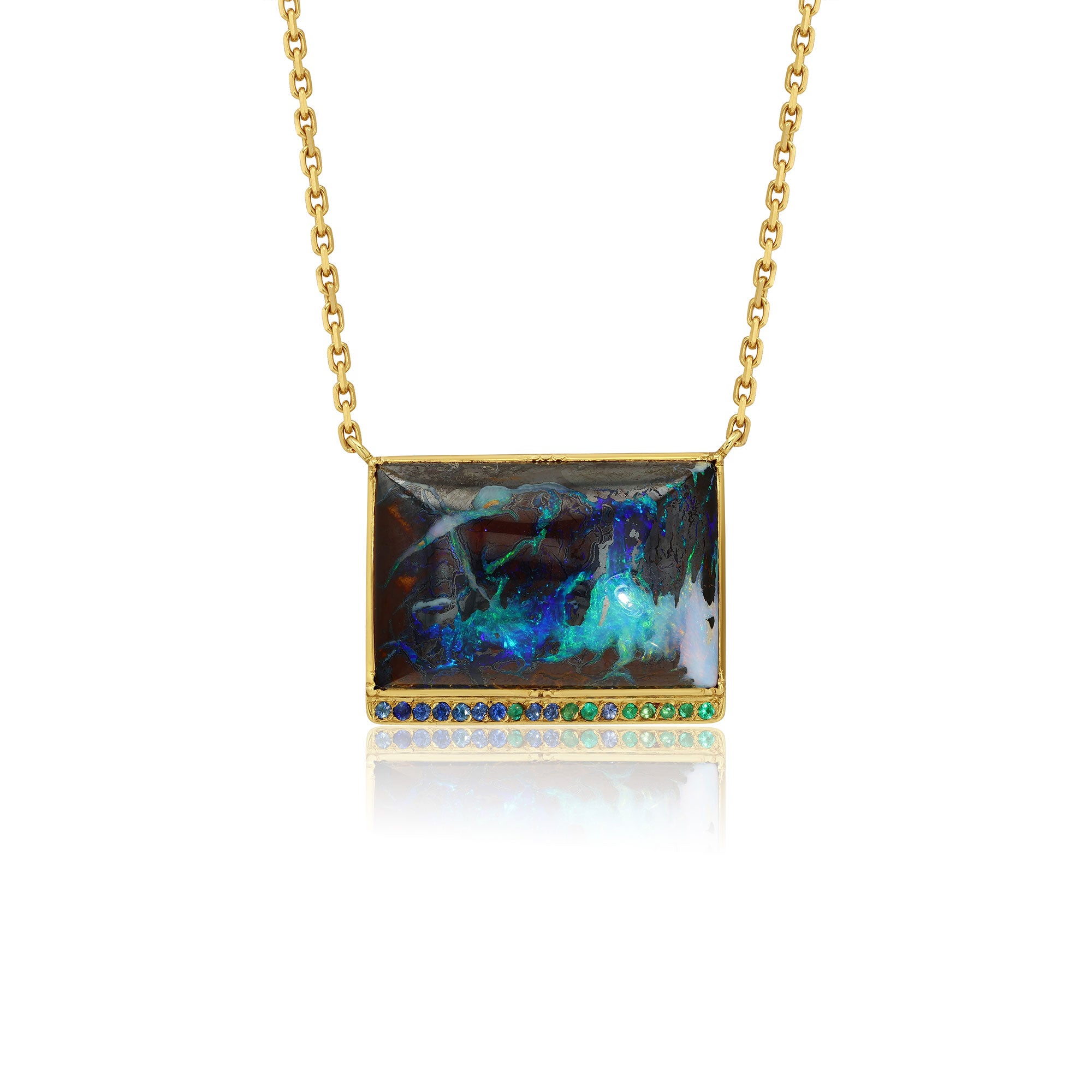 18K gold Necklace with a rectangular yowah nut pendant featuring colorful emerald and sapphire stones on a white background