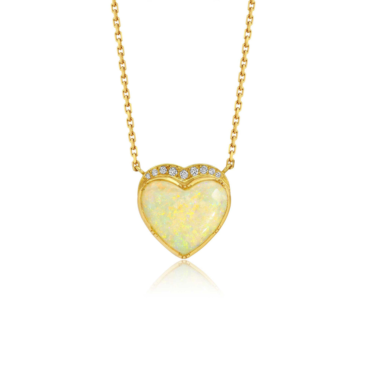 A gold heart pendant necklace featuring a milky white australian opal center stone with a halo of small diamond stones, shown on a clean white background.