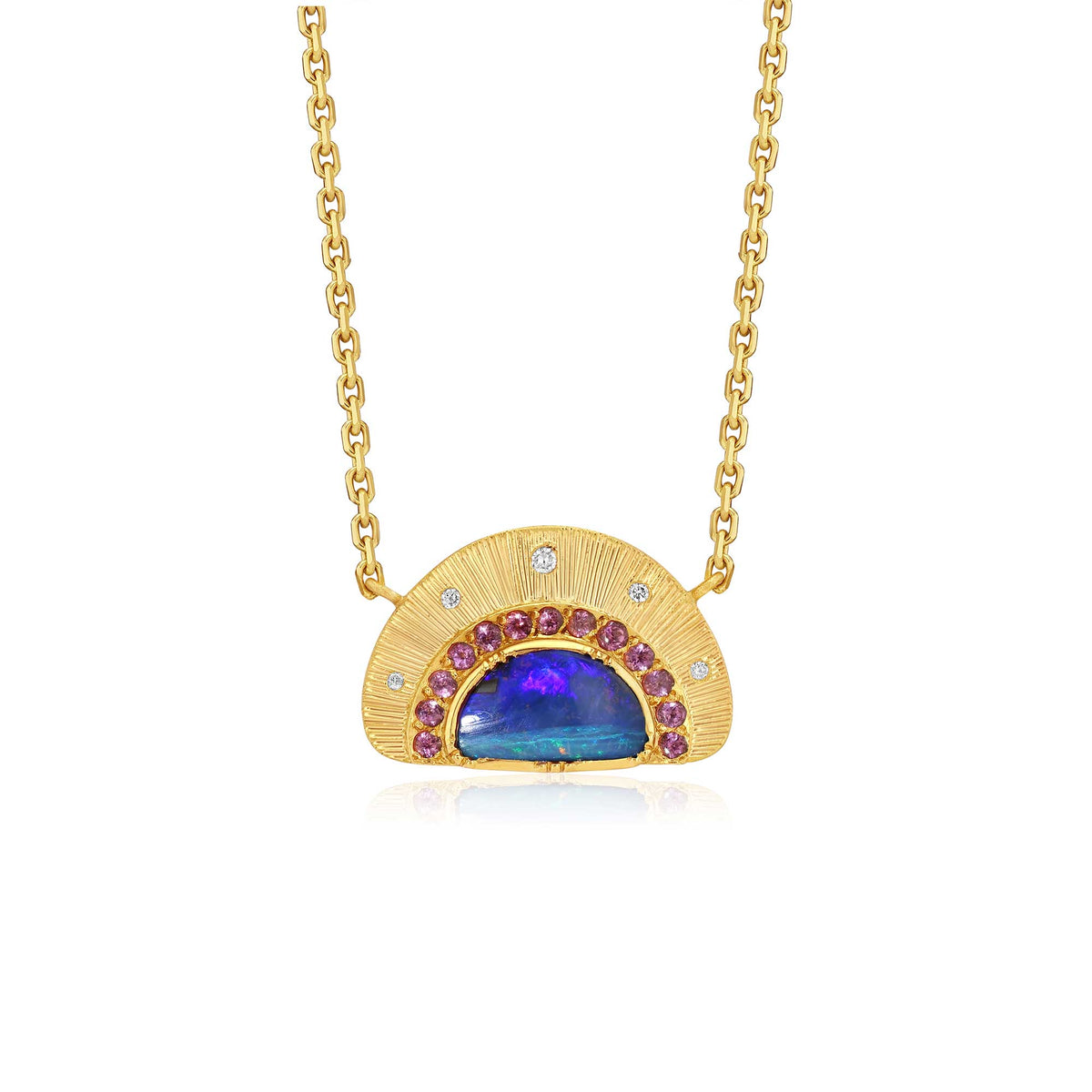 An 18k yellow gold pendant necklace featuring a semi-circular sunburst hand engraved design with a central blue boulder opal accented by small purple  garnet gemstones and tiny diamond stones, shown on a white background.