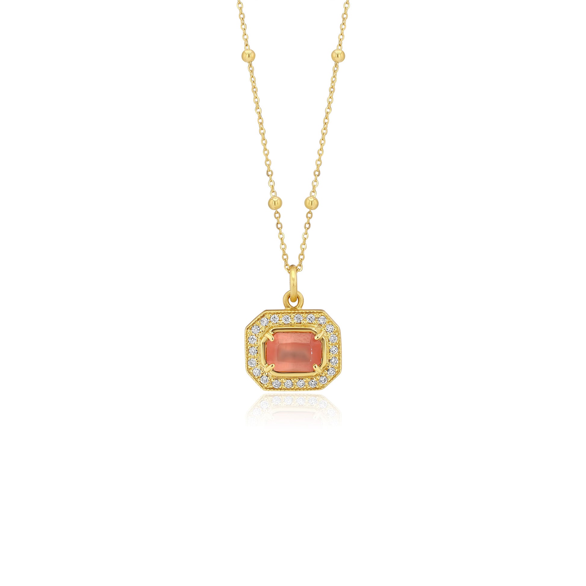Gold pendant with a central rhodochrosite gemstone with white diamond pave detailing on a white background