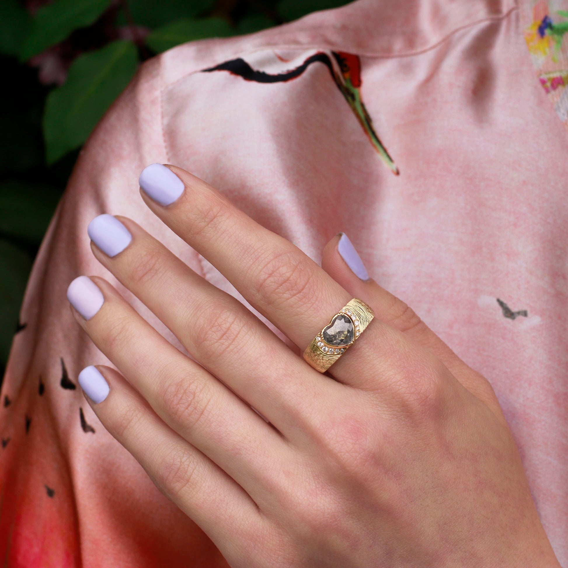 Model wearing one of a kind 18k gold heart-shaped diamond ring with diamond pave and hand engraved  band from Los Angeles designer Brooke Gregson
