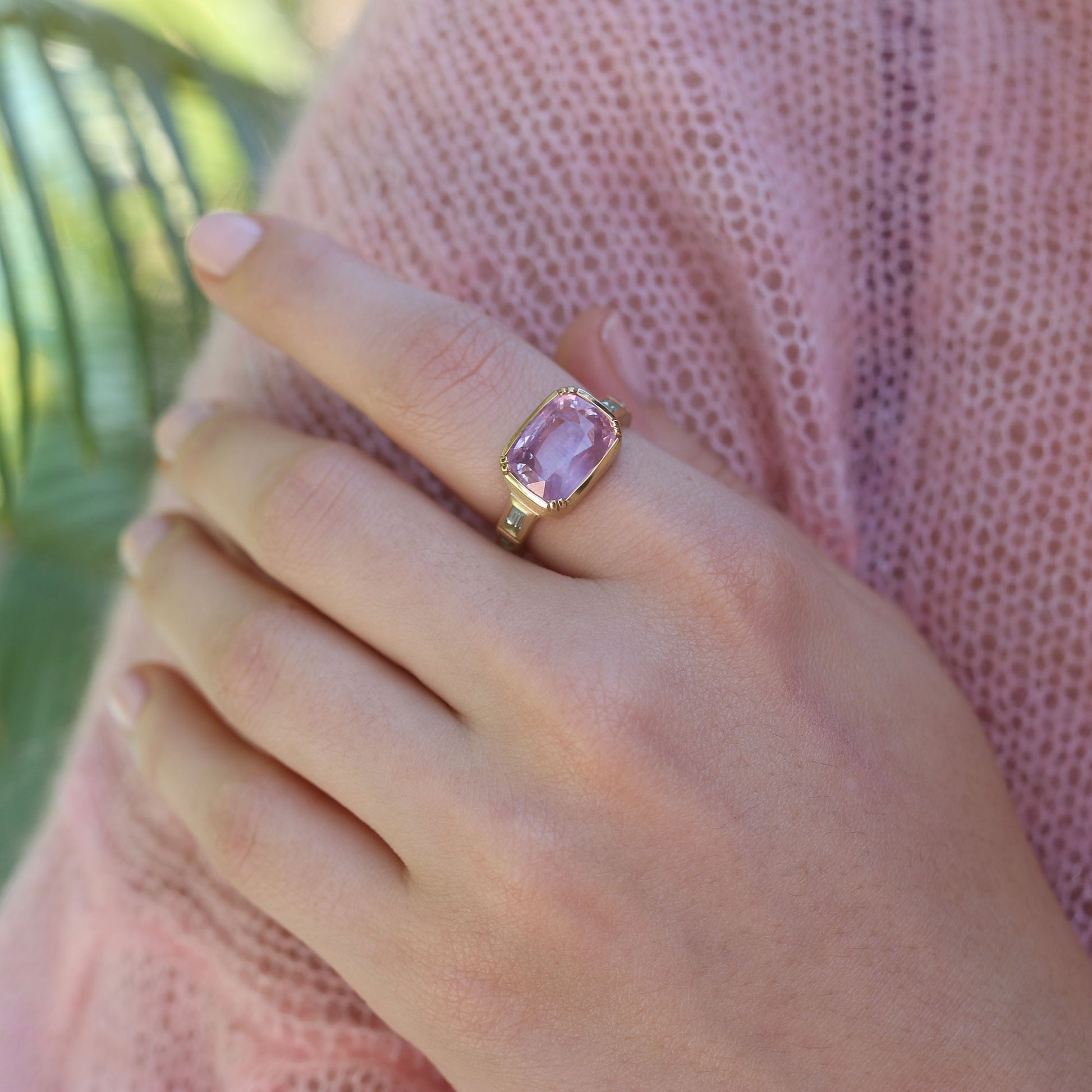 Model wearing one of a kind Pink Sapphire Ring with Green Beryl band from fine jewelery designer Brooke Gregson handmade in London