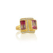 Front view of 18k gold ring with bi colour tourmaline gemstones and pave diamonds on a white background