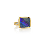 18k gold ring with a large boulder opal stone on a white background