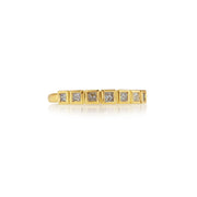 18k gold ring with pink princess cut diamonds on a white background.