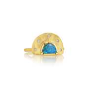 Gold ring with a blue opal stone on a white background