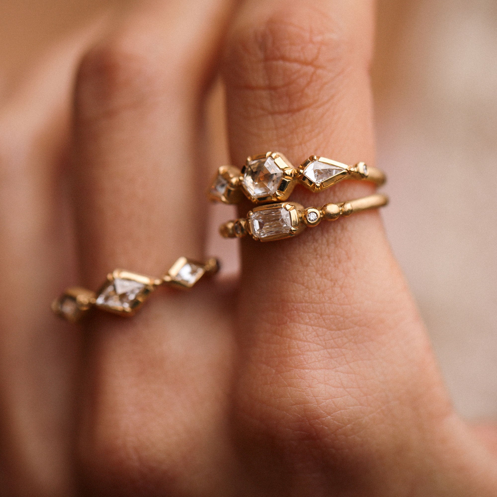 hand with diamond 18k gold rings by designer brooke gregson